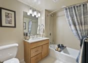 Thumbnail 15 of 25 - a bathroom with a toilet sink and bathtub