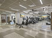 Thumbnail 20 of 25 - a spacious fitness center with treadmills and other exercise equipment