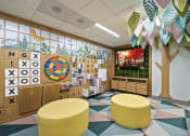 Thumbnail 24 of 25 - a mural of a tree and alphabet blocks decorates the wall of a classroom