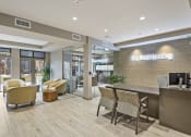 Thumbnail 25 of 25 - a lobby with a reception desk and chairs