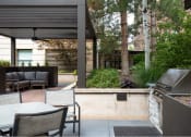 Thumbnail 32 of 34 - Courtyard BBQ next to seating area