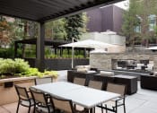 Thumbnail 29 of 34 - Courtyard with seating area and a fireplace