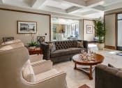 Thumbnail 16 of 34 - Lobby area with a view of the entrance doors and seating area