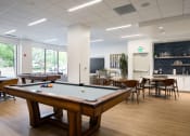 Thumbnail 20 of 34 - Game room with pool table and seating areas