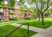 Thumbnail 8 of 10 - Exterior view of Garden Apartments showing the outdoor area