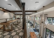 Thumbnail 22 of 35 - a large room with a bar and tables in it