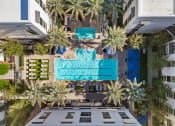 Thumbnail 23 of 35 - a birds eye view of a hotel with palm trees