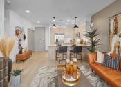 Thumbnail 4 of 35 - Model living room to kitchen