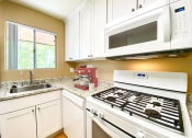Thumbnail 24 of 27 - Electric Range In Kitchen at Carrington Apartments, Fremont, 94538