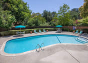 Thumbnail 5 of 32 - Swimming Pool Area With Shaded Chairs at The Glens, San Jose, 95125