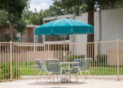 Thumbnail 4 of 46 - Swimming Pool Area With Shaded Chairs at Diablo Pointe, California, 94596