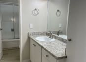 Thumbnail 12 of 12 - Bathroom view with vantiy area with stone countertops at 3543 Brooky Street in Lafayette, CA