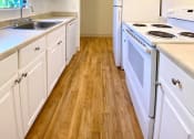 Thumbnail 9 of 46 - Kitchen With White Cabinetry And Appliances at Diablo Pointe, Walnut Creek, CA, 94596
