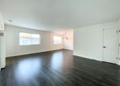 Thumbnail 29 of 30 - Spacious Living Room with Large Windows and Hardwood Flooring at 2120 Valerga in Belmont, CA