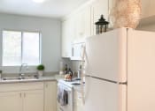 Thumbnail 8 of 9 - Kitchen with fridge at Park Avenue Apartments, San Jose, CA, 95126