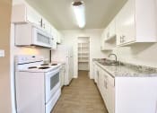 Thumbnail 42 of 43 - Kitchen With White Cabinetry And Appliances at The Monterey, San Jose, CA