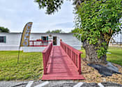 Thumbnail 25 of 30 - Red bridge in front of office at Country Oaks, San Antonio, TX, 78253