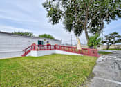 Thumbnail 24 of 30 - Green Space backyard with a patio and a fence at Country Oaks, Texas, 78253