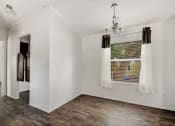Thumbnail 23 of 39 - a bedroom with a large window and white walls