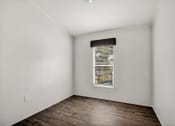 Thumbnail 18 of 39 - an empty room with a window and white walls