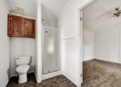 Thumbnail 11 of 39 - a bathroom with a toilet and a shower