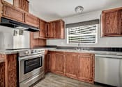 Thumbnail 5 of 30 - Kitchen with wooden closet at Country Oaks, San Antonio, TX, Texas
