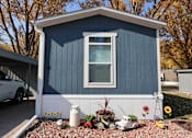 Thumbnail 19 of 46 - a blue storage shed with a window on the side of it at Circle Park, Cheyenne