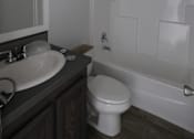 Thumbnail 46 of 46 - a bathroom with a toilet and a sink and a bath tub at Circle Park, Cheyenne, 82007