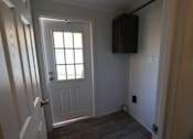 Thumbnail 45 of 46 - a door with a window in a room with a wooden floor at Circle Park, Cheyenne, Wyoming