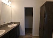 Thumbnail 36 of 46 - a bathroom with a sink and a mirror and a closet at Circle Park, Wyoming