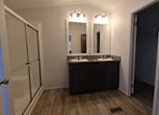 Thumbnail 34 of 46 - a bathroom with two sinks and a shower at Circle Park, Cheyenne, 82007