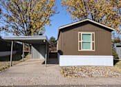 Thumbnail 13 of 46 - the front of a house with a garage and a driveway at Circle Park, Cheyenne