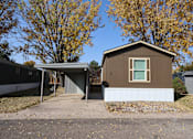 Thumbnail 15 of 46 - the front of a house with a driveway and a car garage at Circle Park, Cheyenne, 82007