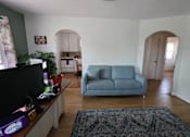 Thumbnail 11 of 22 - a living room with a blue couch and a tv at Country Lane, Wyoming