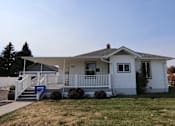 Thumbnail 4 of 22 - house with a porch and a lawn at Country Lane, Cheyenne, Wyoming