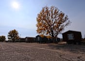 Thumbnail 6 of 22 - a row of small houses on the side of a road at Country Lane, Wyoming