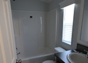 Thumbnail 20 of 20 - a small bathroom with a toilet and a sink at Horizon MHC, Rock Springs, WY