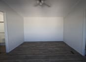 Thumbnail 17 of 20 - an empty room with a ceiling fan and a white wall at Horizon MHC, Rock Springs, 82901