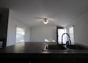 Thumbnail 16 of 20 - an empty kitchen with a sink and a ceiling fan at Up House, Connecticut