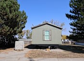 Thumbnail 3 of 9 - the exterior of a tiny house on a trailer at Kimberly Village, Cheyenne, WY, 82007