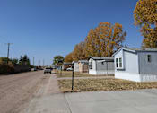 Thumbnail 6 of 7 - a row of mobile homes on the side of a road at Mobile Home Village, Wyoming
