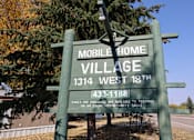 Thumbnail 3 of 7 - a sign for mobile home village at Mobile Home Village, Cheyenne