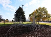 Thumbnail 7 of 19 - a large spider web sculpture in a park at Pioneer Park, Green River, WY