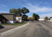 Thumbnail 14 of 19 - a street in a neighborhood with houses and trees at Pioneer Park, Green River