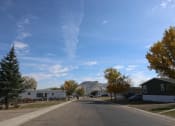 Thumbnail 19 of 19 - a street with houses and trees and a mountain in the background at Pioneer Park, Green River, 82935