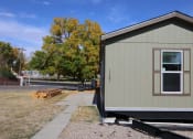 Thumbnail 9 of 19 - the front of a tiny house on a trailer at Pioneer Park, Green River, WY