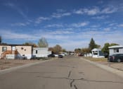 Thumbnail 17 of 19 - a street with houses and cars parked on the side of it at Pioneer Park, Green River, WY