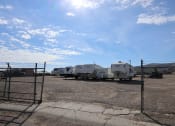 Thumbnail 16 of 19 - a row of trailers parked in a lot behind a fence at Pioneer Park, Green River