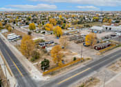 Thumbnail 2 of 22 - an aerial view of a city with a highway and trees at Country Lane, Wyoming