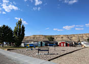 Thumbnail 2 of 5 - A park with a bench and a playground.